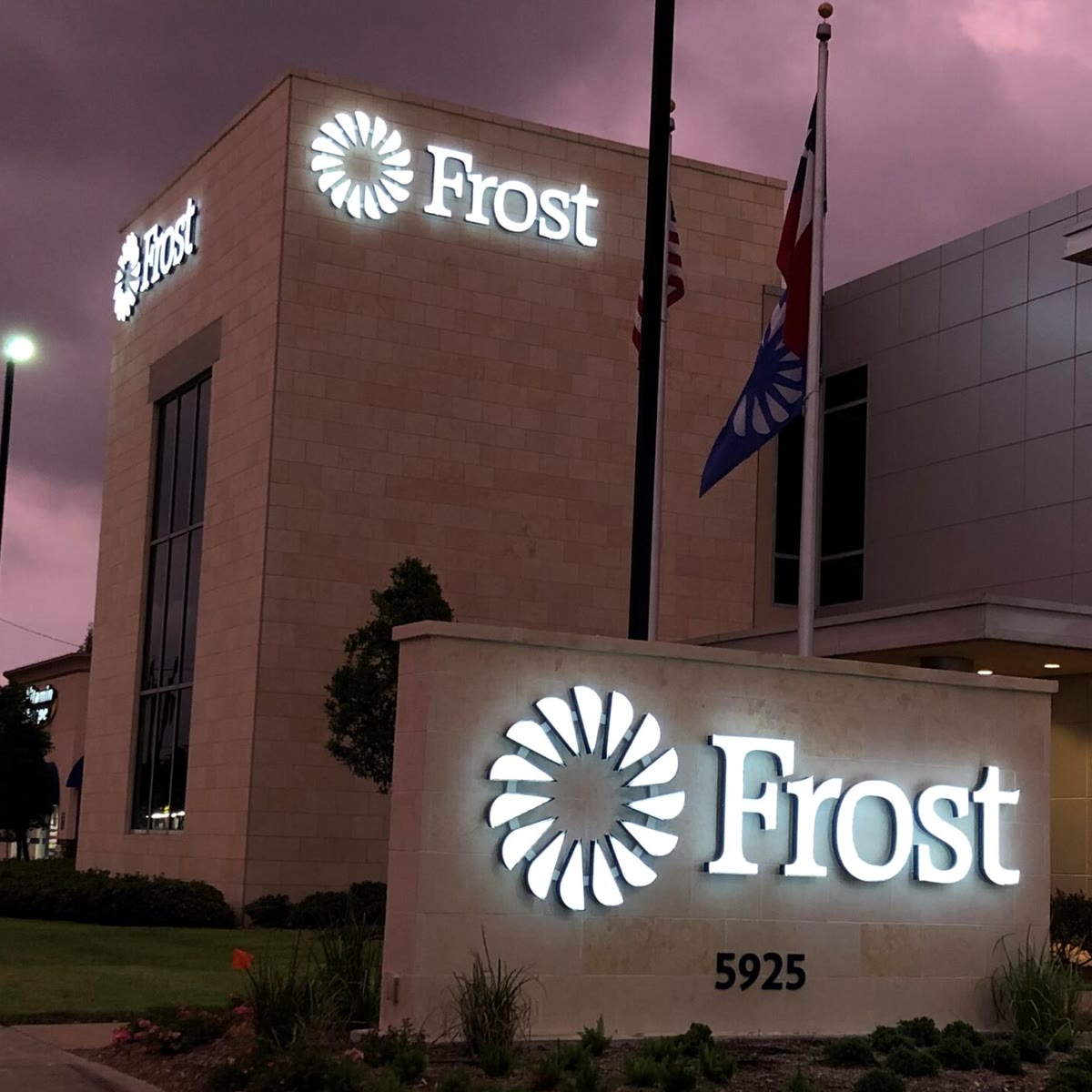 Frost Bank โ illuminated dusk branch signage